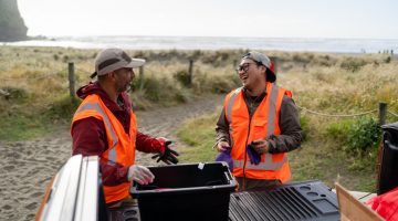 volunteer  workers on beach